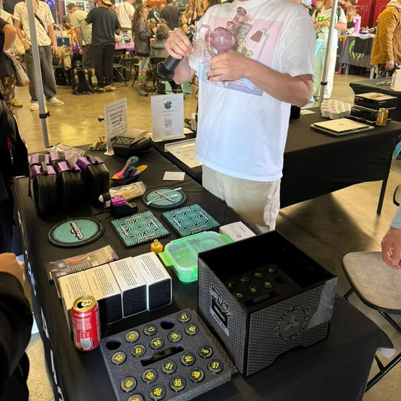 Vendor table with product trays and glass