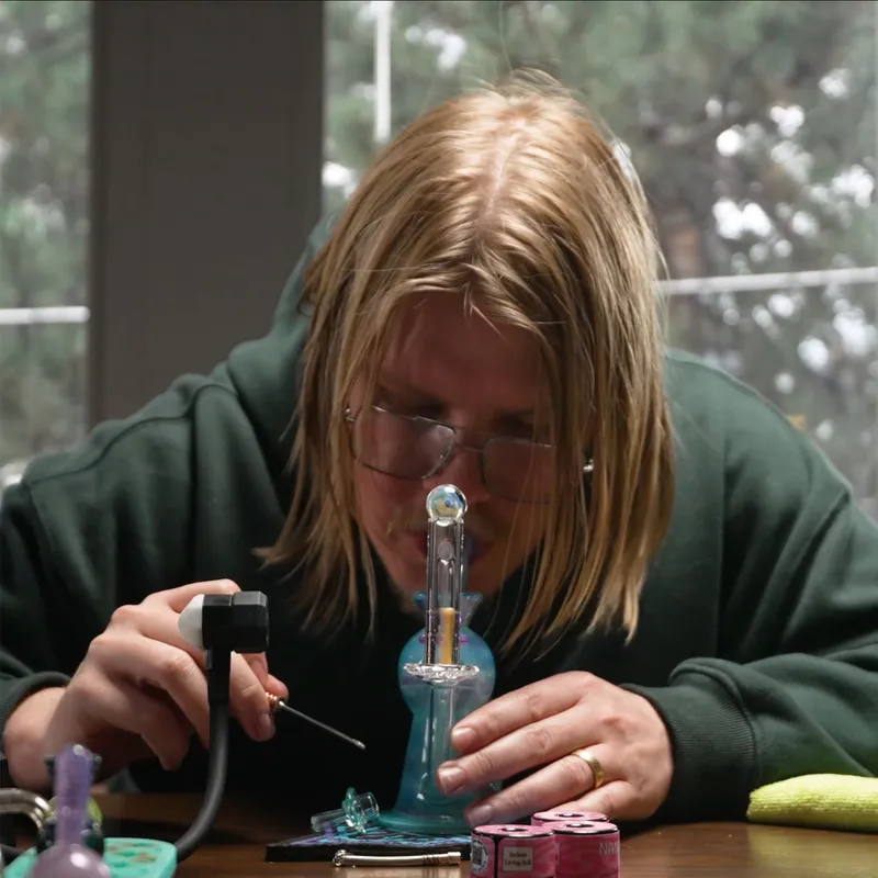 Person dabbing at a table
